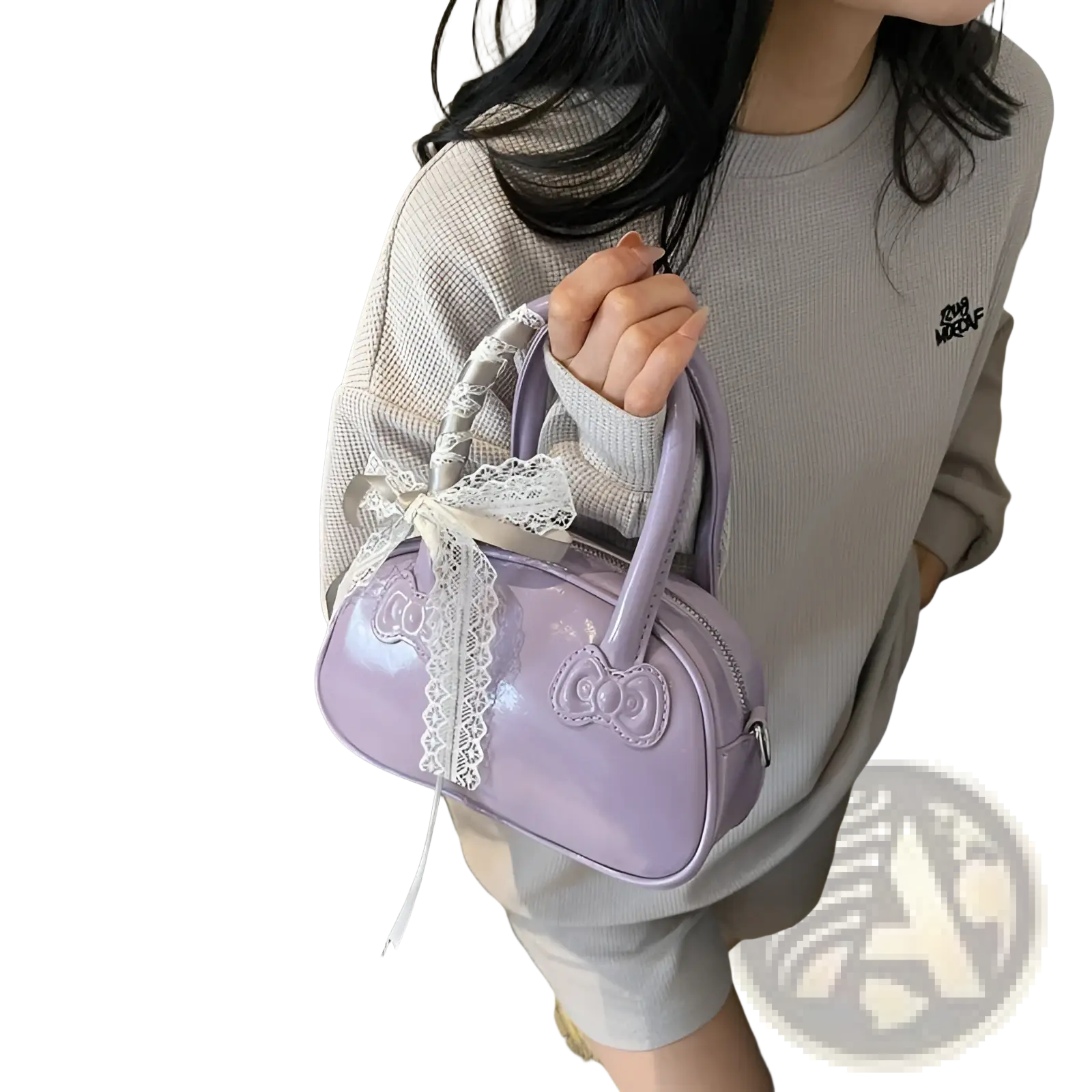 Hello Kitty glossy lace bow crossbody bag in lavender with a prominent bow emblem and delicate white lace trim