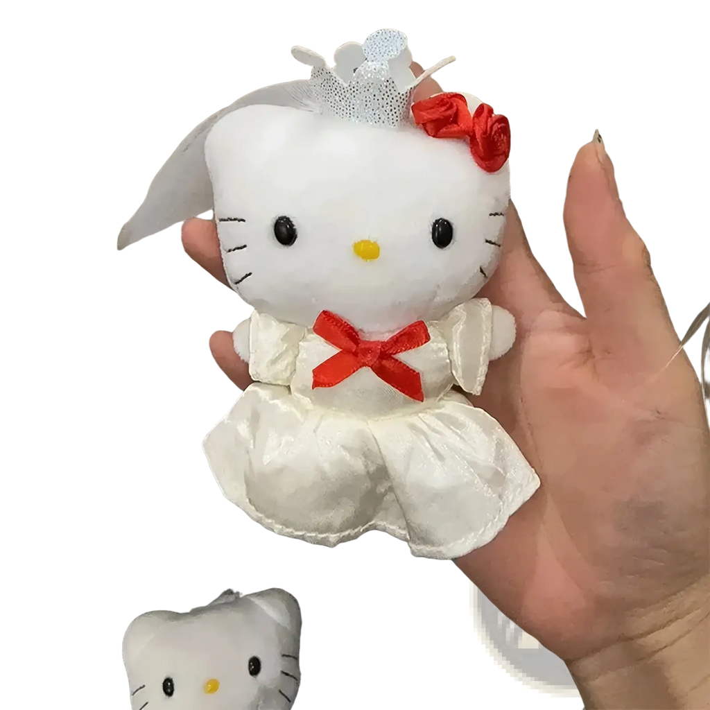 Hello kitty wedding couple plush keychain featuring a white satin doll in a wedding gown with red ribbons and lace veil