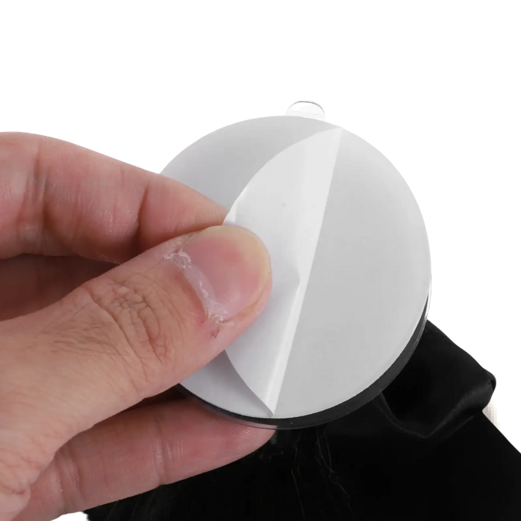 White circular adhesive mount with black base and clear suction cup for helmet ponytail black brown bow decoration