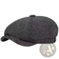 A dark gray herringbone tweed wool flat cap with an octagonal beret design and a short structured brim