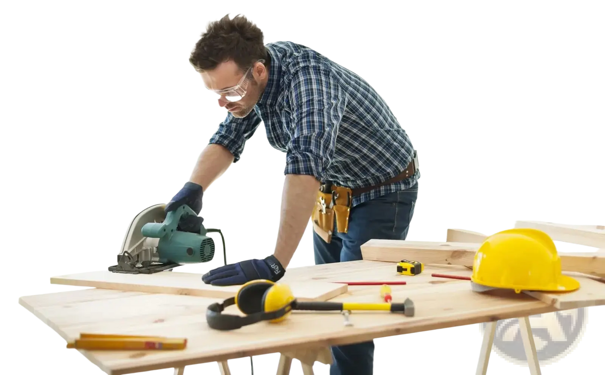 A man wearing high dexterity blue touch screen work gloves uses a green circular saw on a wooden workbench