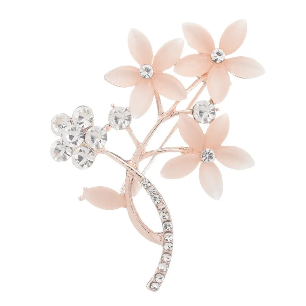Vintage opal and rose gold floral bridal brooch with blush pink translucent petals and clear crystal accents on rose gold base