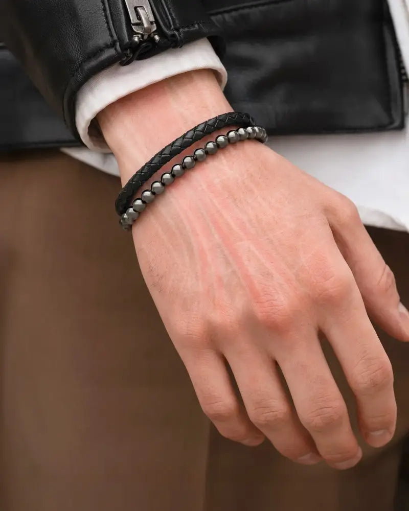 Black braided leather bracelet with silver-toned hematite magnetic beads for high power energy balance