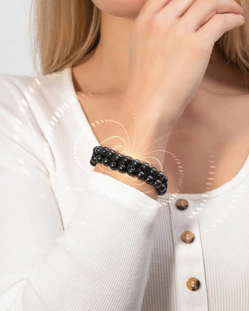 Black beaded double row high power magnetic hematite bead bracelet worn on wrist showcasing its design and material