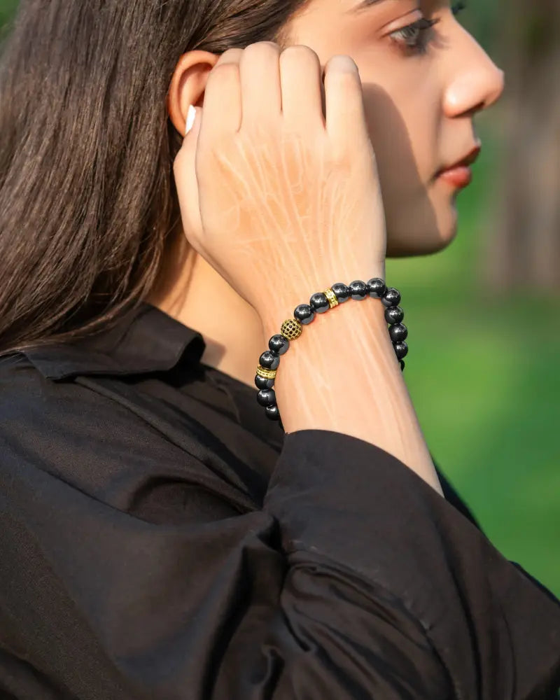 Black beaded gold zeus high power magnetic hematite bead bracelet with gold toned spacer beads