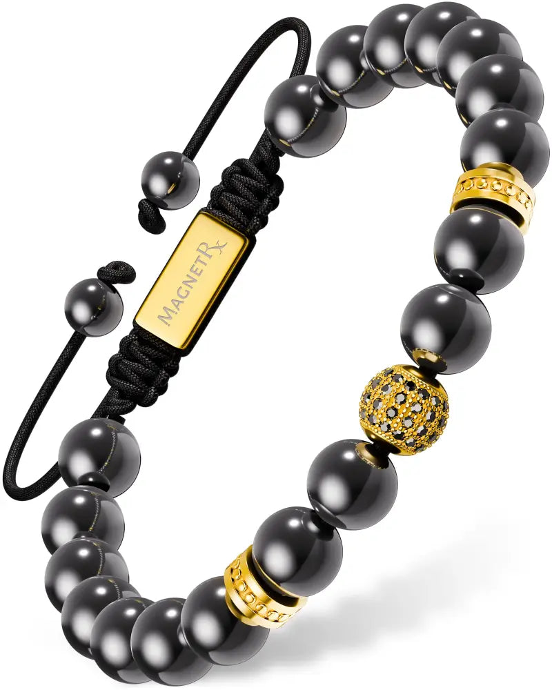 Gold Zeus high power magnetic hematite bead bracelet with black beads gold-toned accents and rectangular branded tag