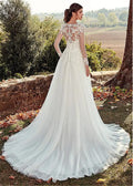 Back view of a white lace long sleeve a-line tulle wedding gown with intricate lace detailing and lightweight fabric
