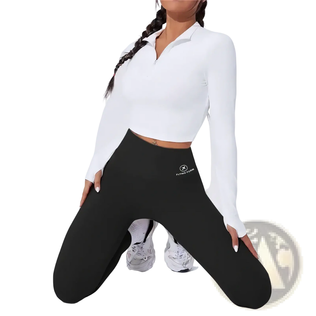 Black high waist butt lifting thermal yoga leggings with small white logo on left thigh for cold weather workouts