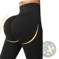 Black high waist butt lifting yoga leggings with gold accent lines showing the back side of the garment