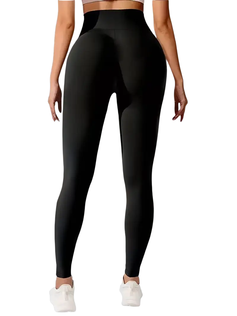 Black high waist butt lifting yoga leggings with smooth form fitting material shown from the back side