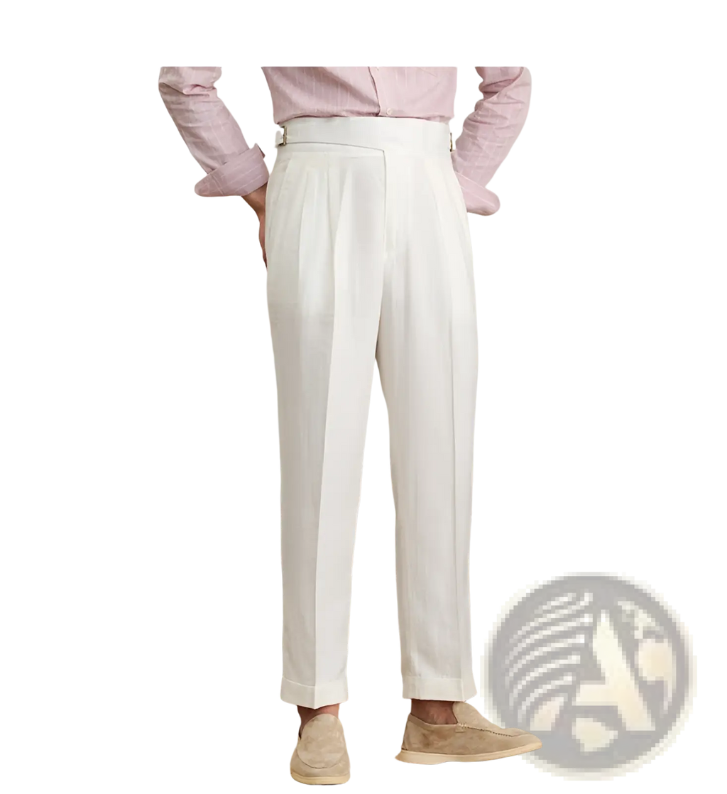White high waist cotton linen pleated trousers with straight leg and cuffed hems in a front view