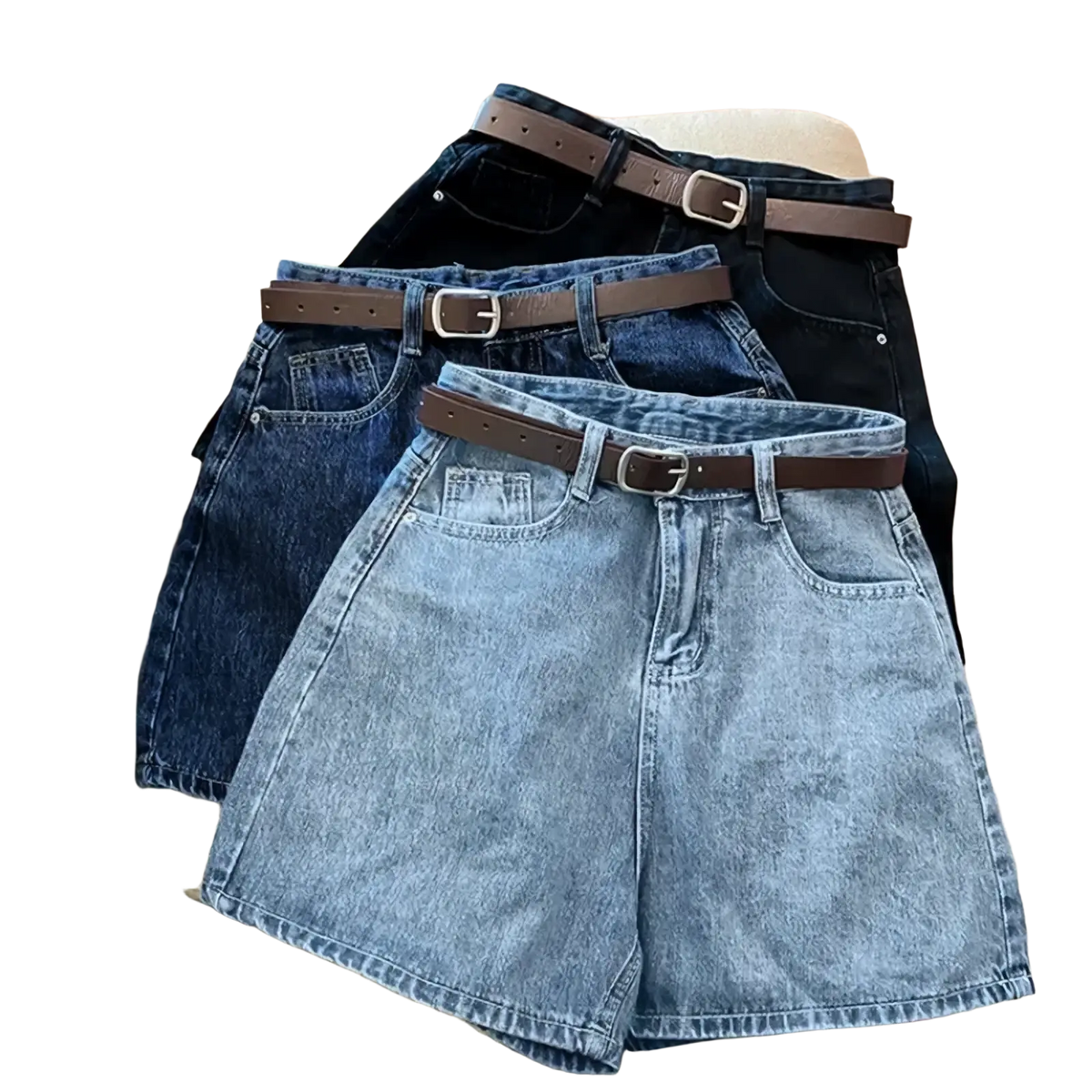 Three high waist denim shorts in varying blue shades paired with brown leather belts with silver buckles