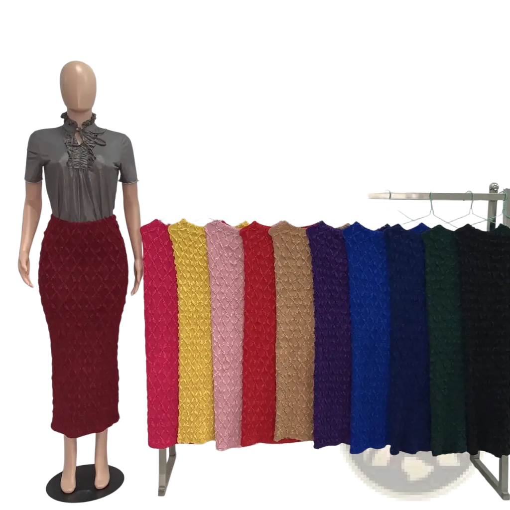 A high waist slim fit midi skirt in rich red textured ribbed knit displayed on a mannequin
