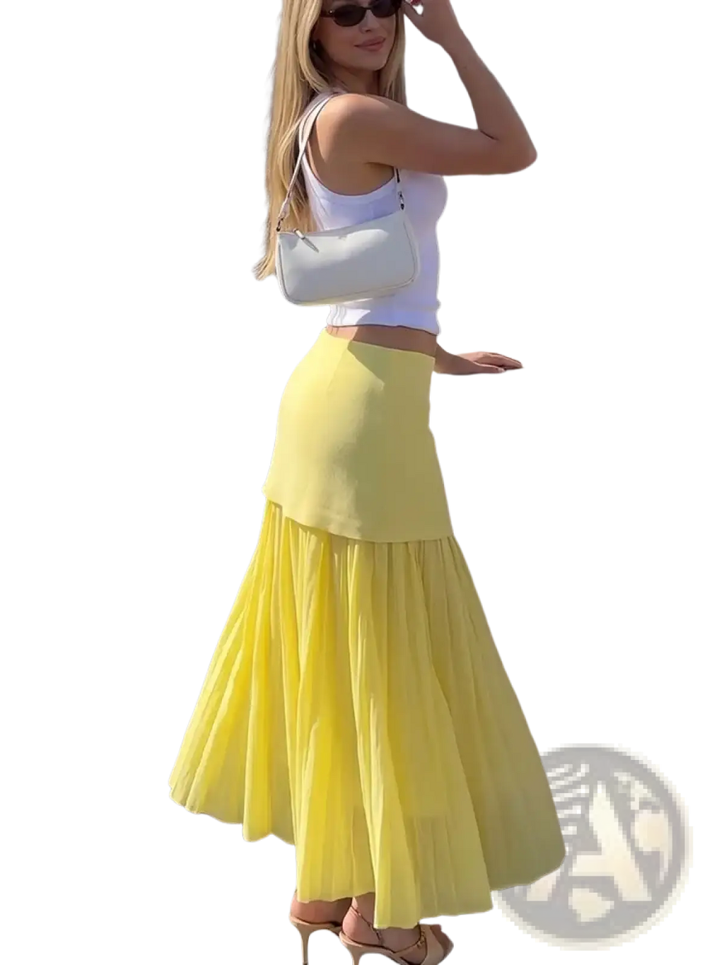 A white structured shoulder bag with a sleek design and thin strap paired with a high waist pleated long skirt