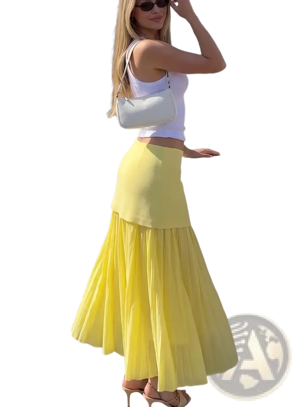 A white structured shoulder bag with a sleek design and thin strap paired with a high waist pleated long skirt