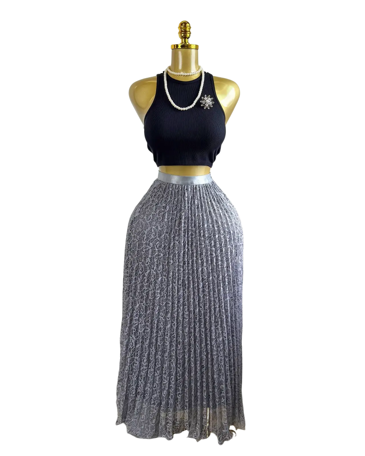 A shimmering silver pleated midi skirt with a subtle pattern displayed on a mannequin for Y2k streetwear