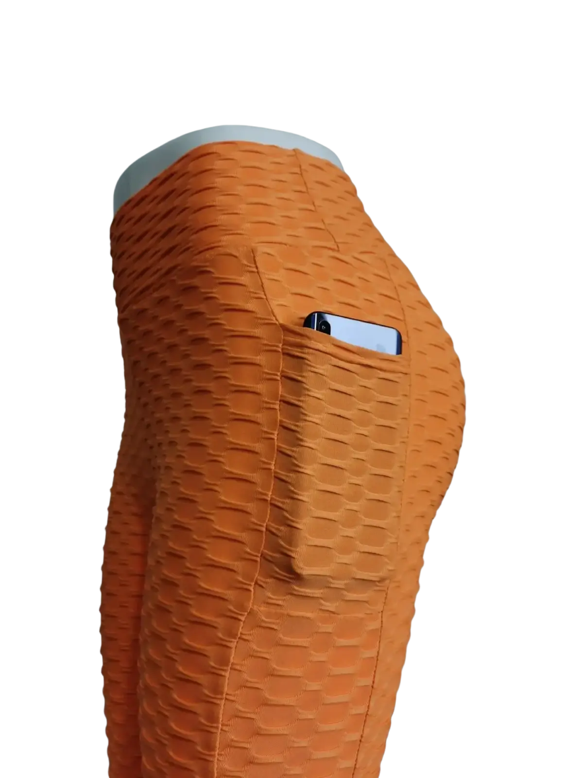 Orange high waist pocket bubble leggings with textured fabric and built-in pocket holding a smartphone