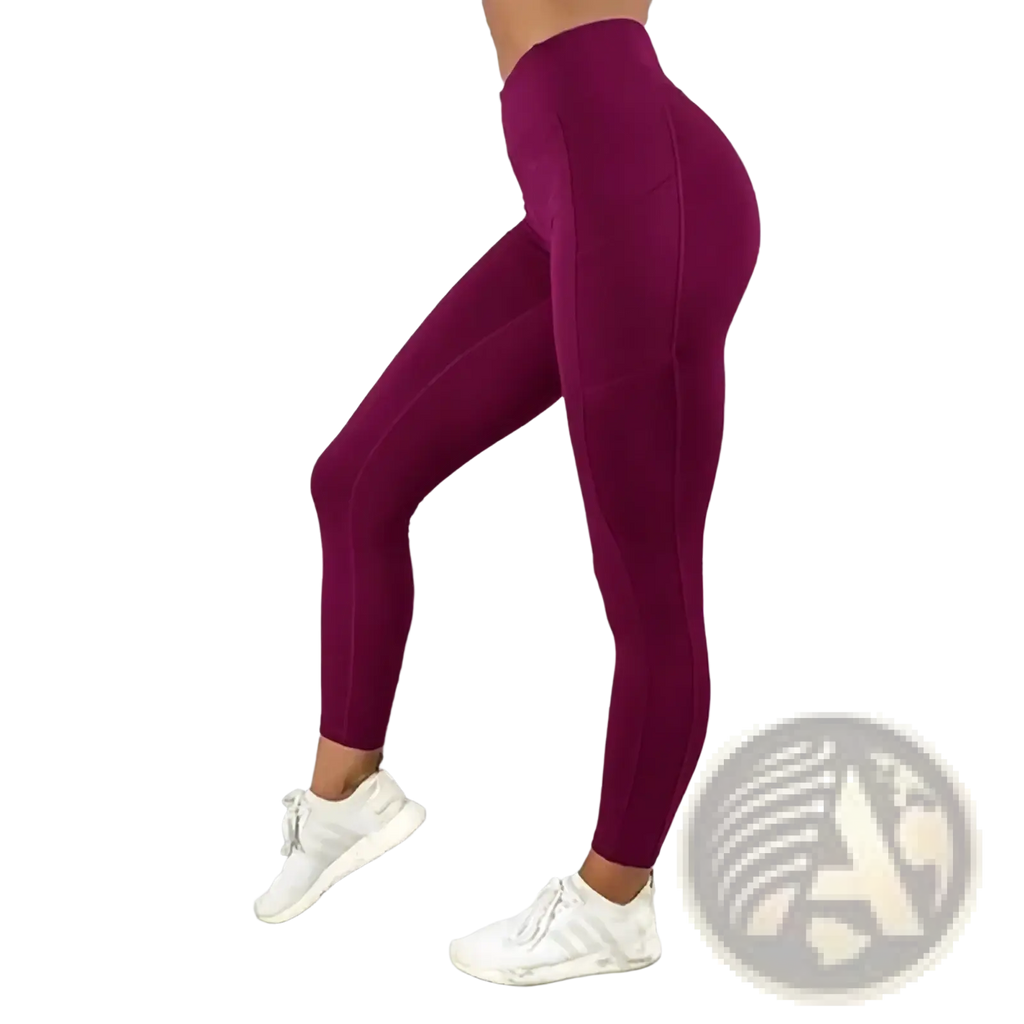 Fitted maroon high waist pocket workout leggings for women made of smooth stretchy fabric with subtle side seam detailing