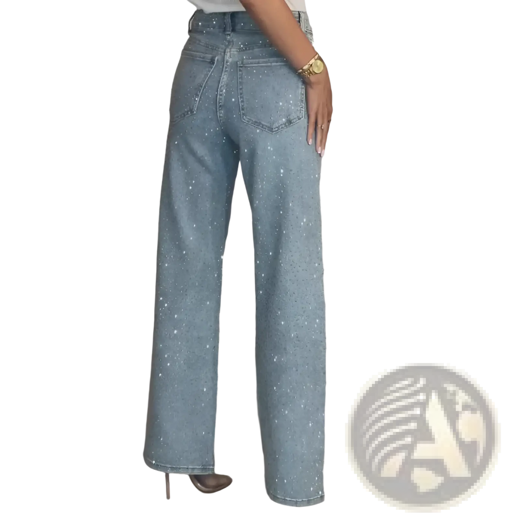 Light-wash high waist denim jeans with wide-leg cut and scattered sparkling rhinestones star print design