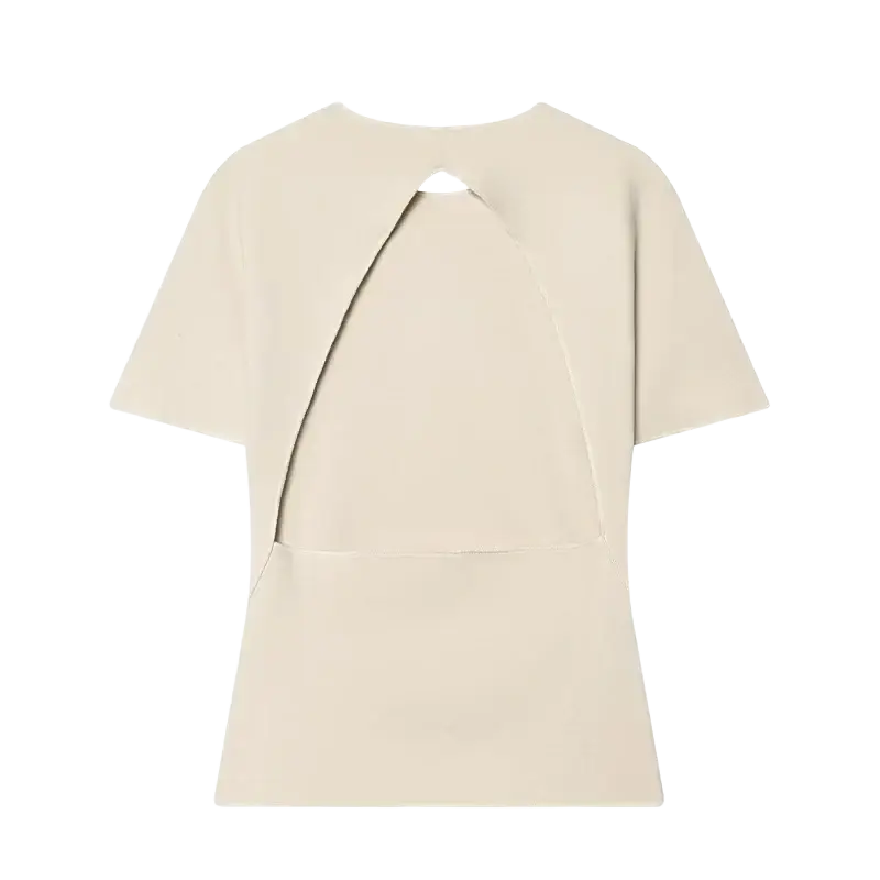 Beige short sleeved top with a back cutout closure, part of a high waist two piece set with wide leg cream pants