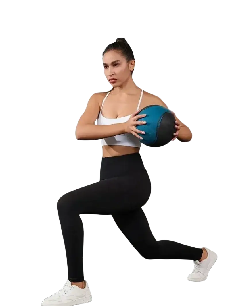 Blue and black weighted exercise ball placed on high waisted black yoga leggings with pockets