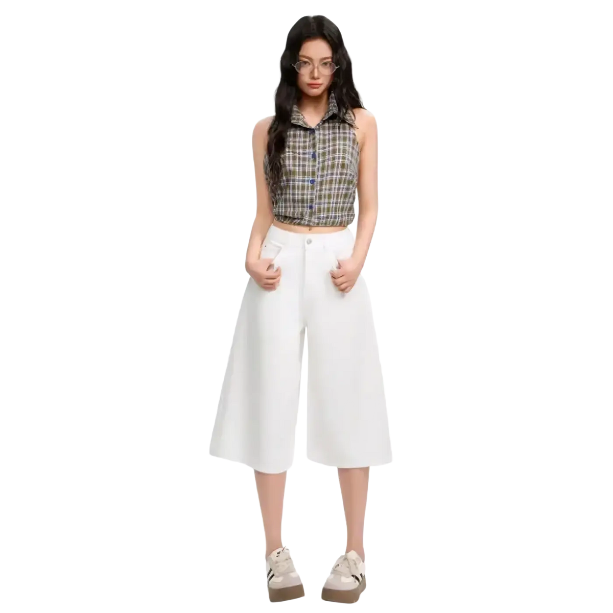 A sleeveless plaid crop top with collar and buttons in green blue and beige paired with high waisted wide leg denim shorts