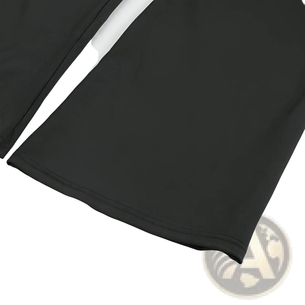 Black high-waisted flare yoga pants made of smooth fabric with a clean hem and subtle stitching detail