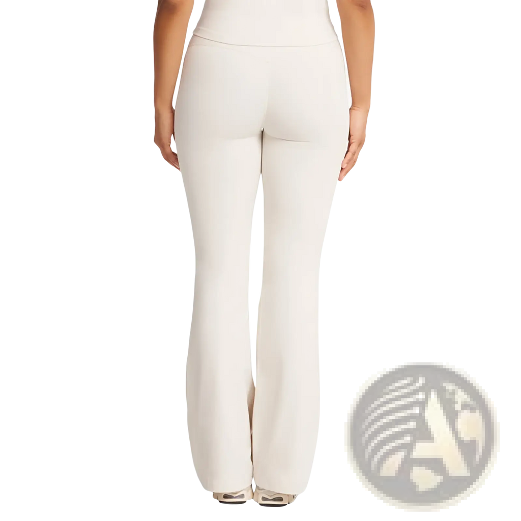 Cream-colored high waisted flare yoga pants made from smooth stretchy fabric with a comfortable fit