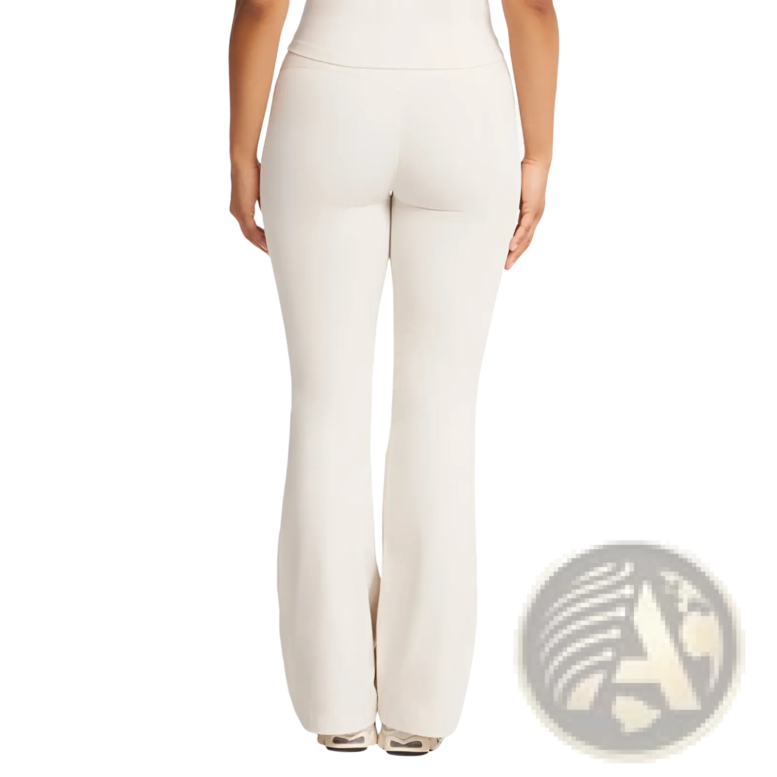 Cream-colored high waisted flare yoga pants made from smooth stretchy fabric with a comfortable fit
