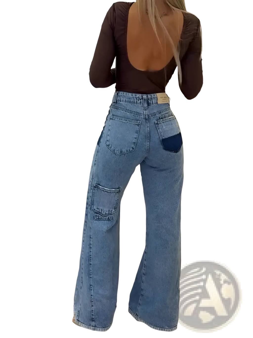 Back side of high waisted flared jeans in light blue denim with dark blue patch and large cargo pockets