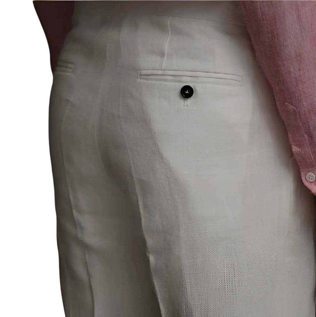 Off-white high waisted linen trousers for men with subtle texture and single black button on back pocket shown from back side