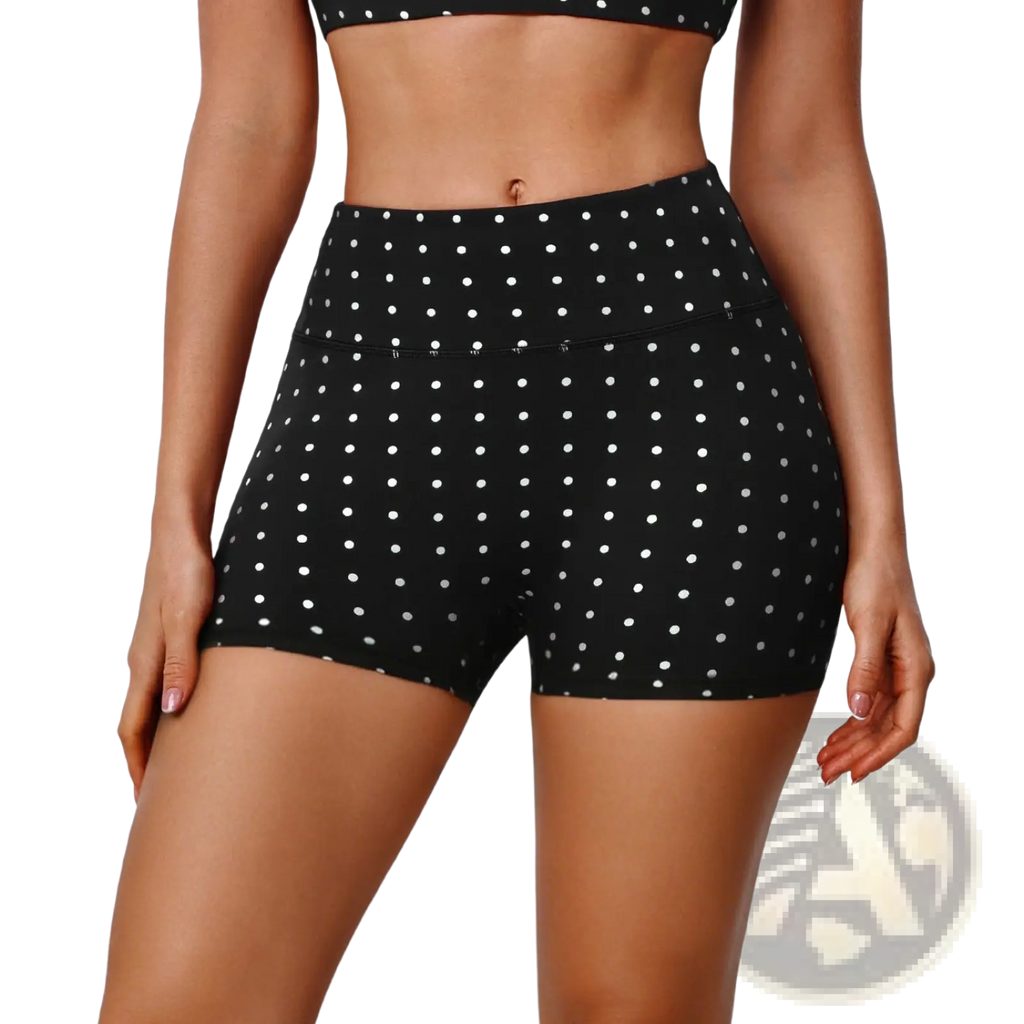 Black high waisted cycling shorts with white polka dots featuring a comfortable stretch fabric for active wear