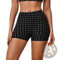 Black high waisted cycling shorts with white polka dots featuring a comfortable stretch fabric for active wear
