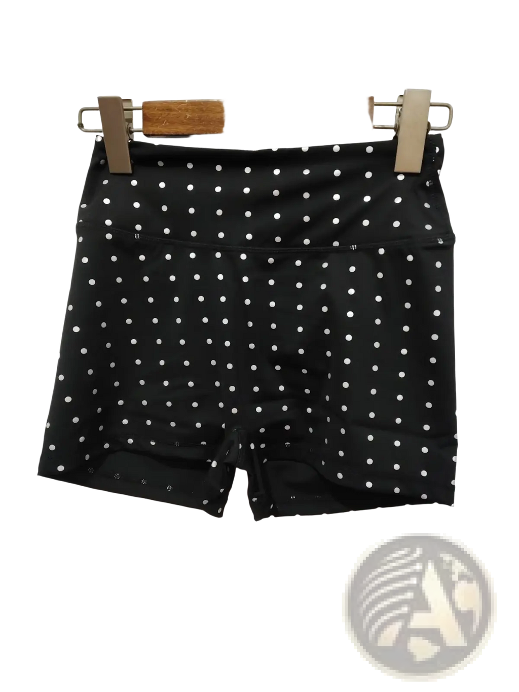 High waisted black cycling shorts with white polka dots made of smooth stretchy fabric for active wear