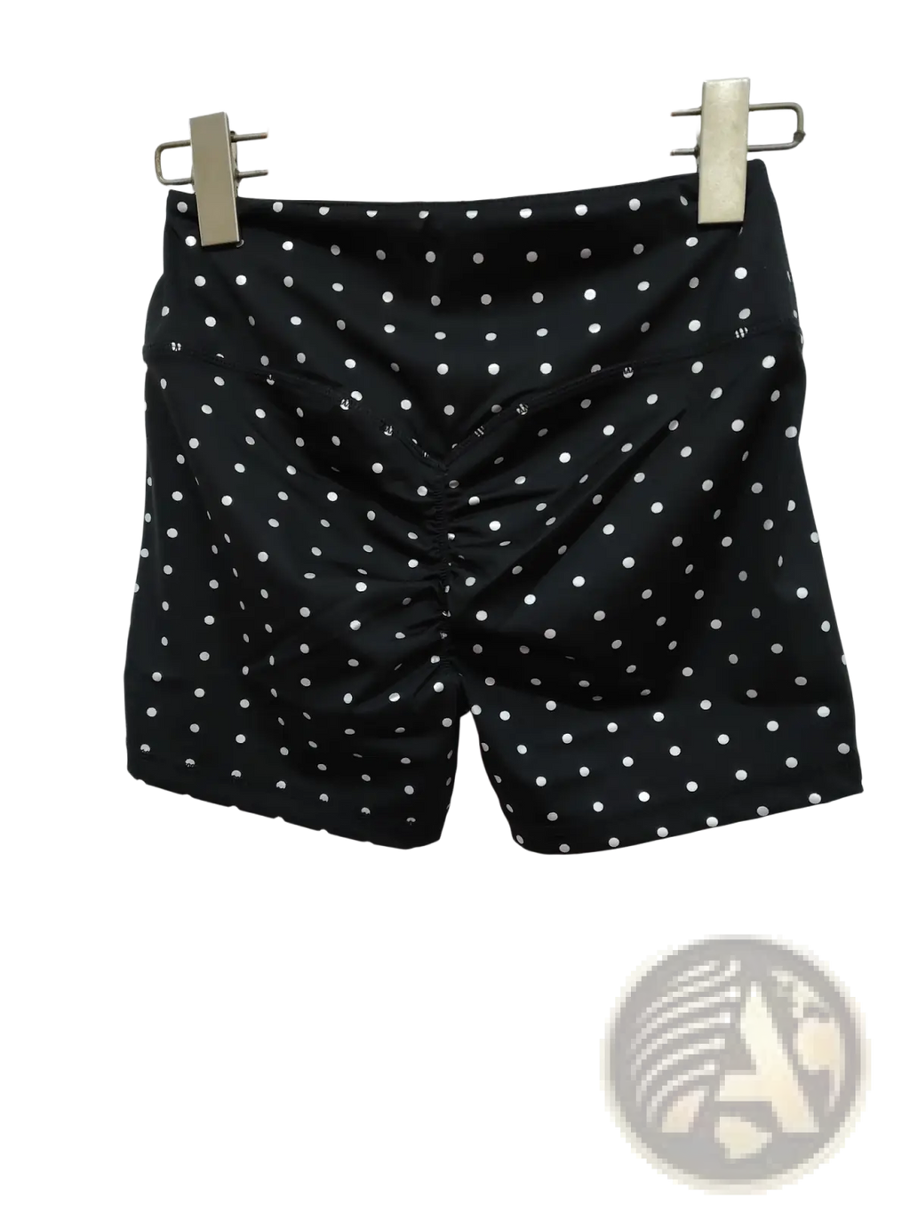 High waisted black cycling shorts with white polka dots made of smooth slightly shiny fabric