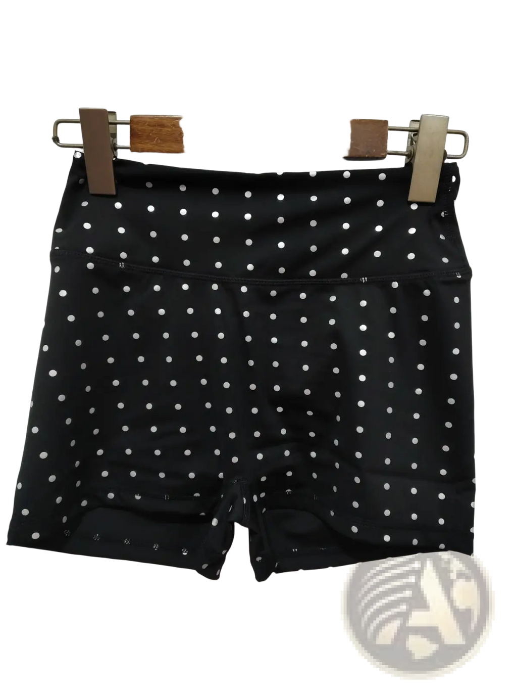 High waisted black cycling shorts with white polka dots and elastic waistband for comfortable fit