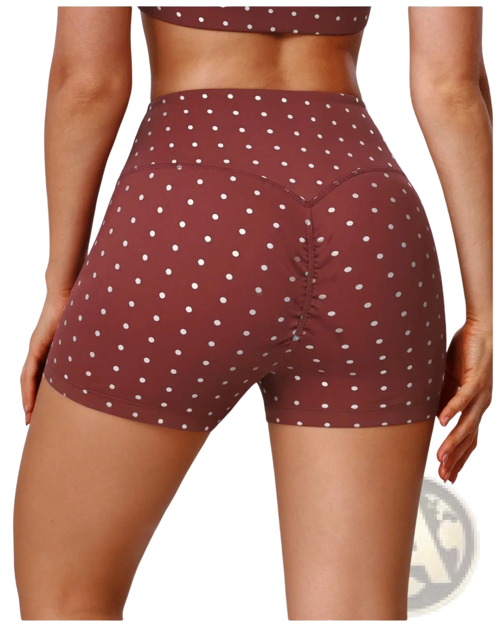 Back view of brown high waisted polka dot cycling shorts with white dots and ruched detailing