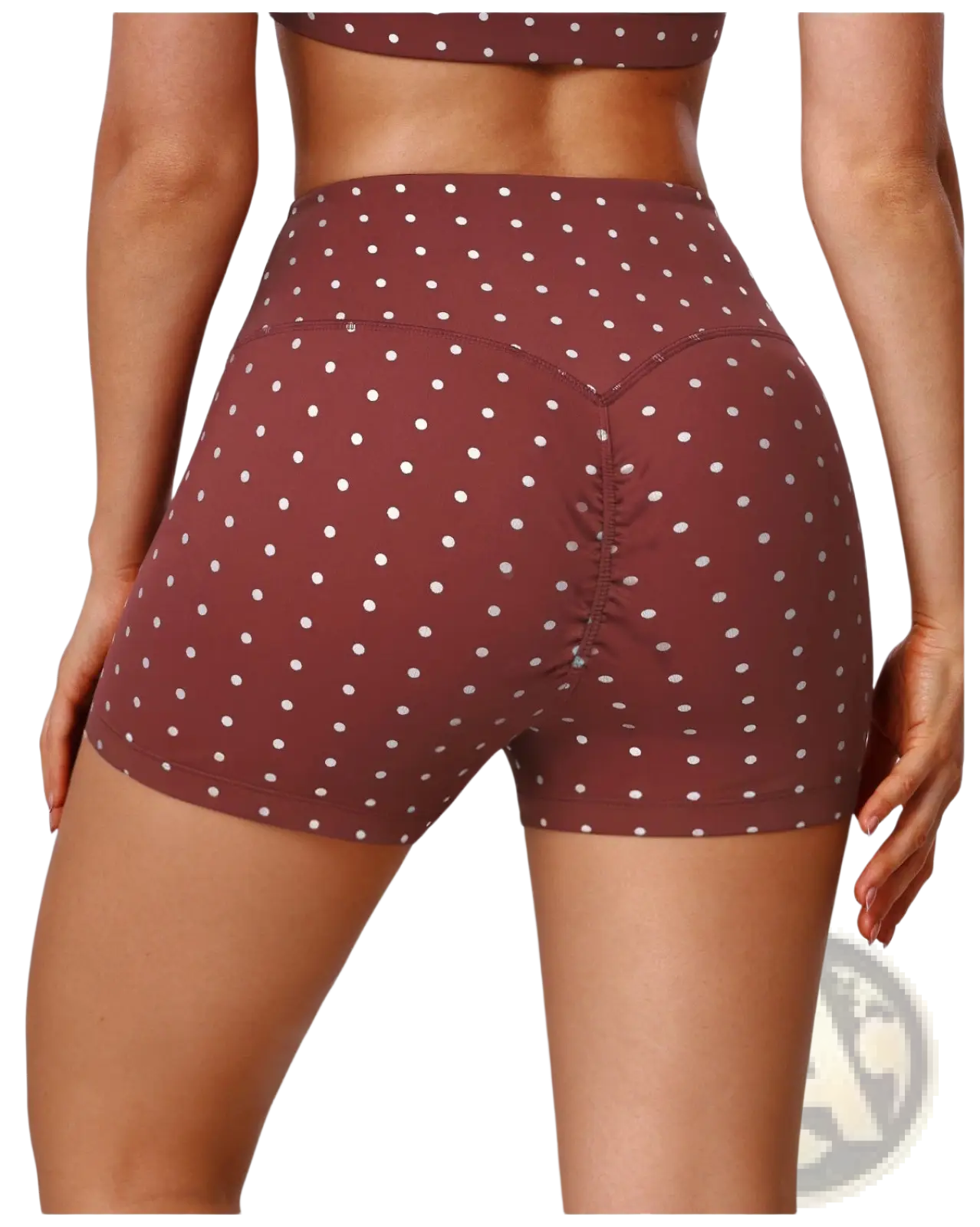 Back view of brown high waisted polka dot cycling shorts with white dots and ruched detailing
