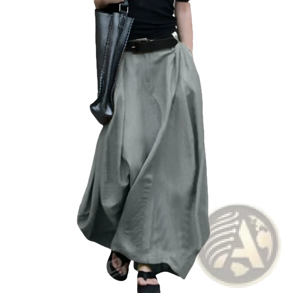 High-waisted satin maxi skirt with flowing gray wide-leg pants featuring a relaxed fit and subtle texture