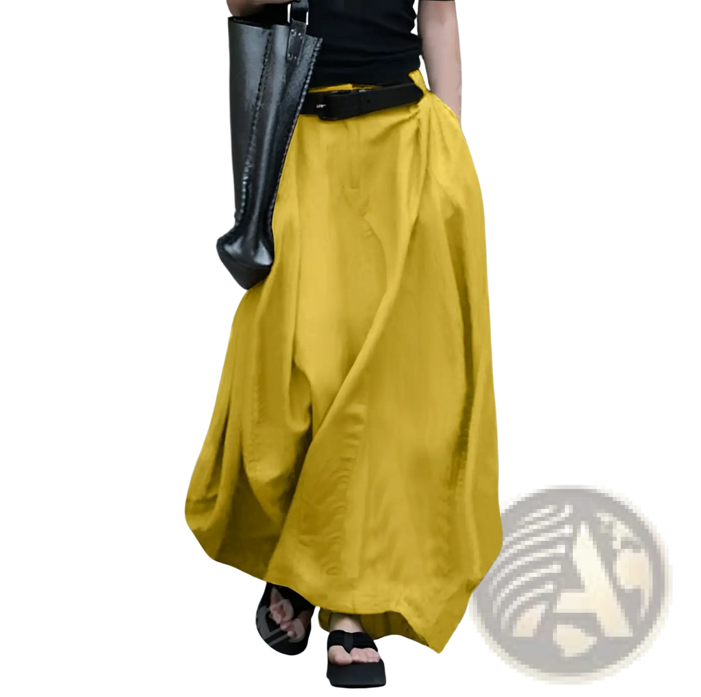 High-waisted satin maxi skirt in mustard yellow with a flowing wide-leg and relaxed draped silhouette