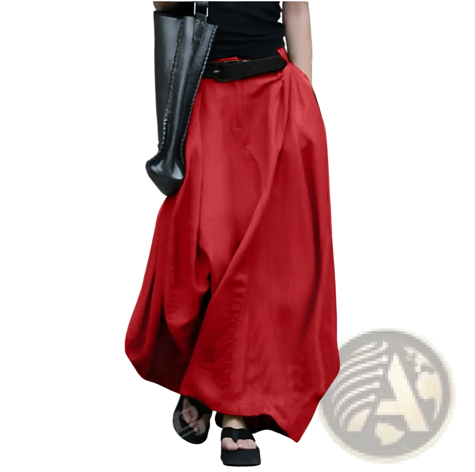 A flowing vibrant red high-waisted satin maxi skirt with a loose draped silhouette and a black belt at the waist