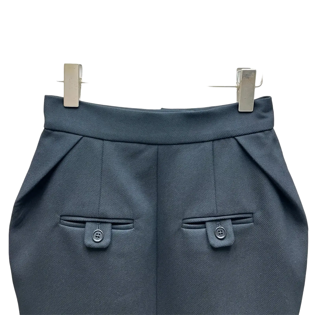 High waisted straight pencil skirt in dark gray tailored fabric with structured waistband and buttoned flap pockets