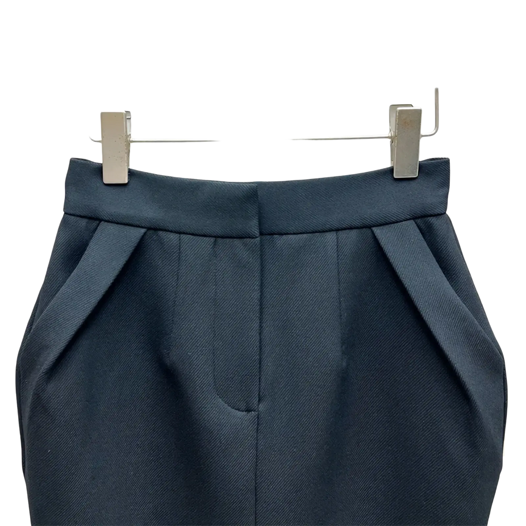 High waisted straight pencil skirt in dark navy with a structured waistband and subtle pleated texture