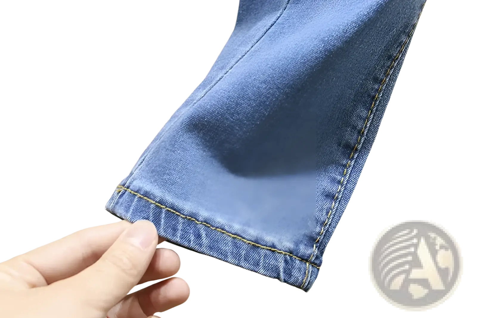 High waisted stretch light blue denim jeans cuff with yellow stitching showcasing detailed craftsmanship