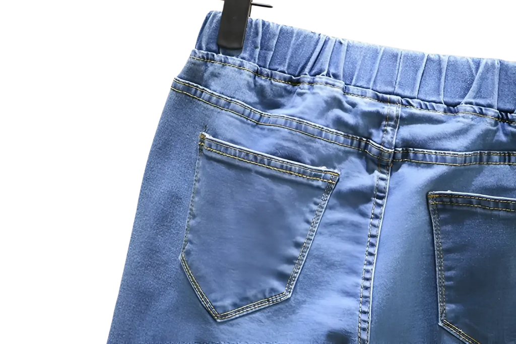 High waisted stretch light blue denim jeans with elastic waistband and two back pockets shown from the back side