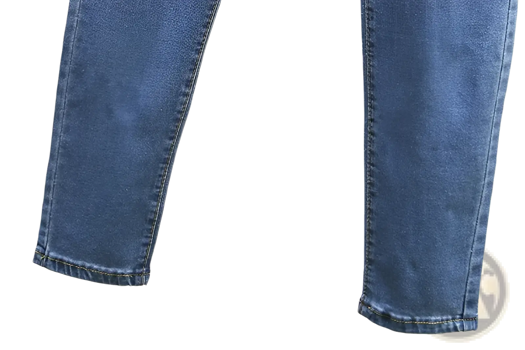 High waisted stretch light blue denim jeans with mid-wash slim fit and neatly stitched cuffs
