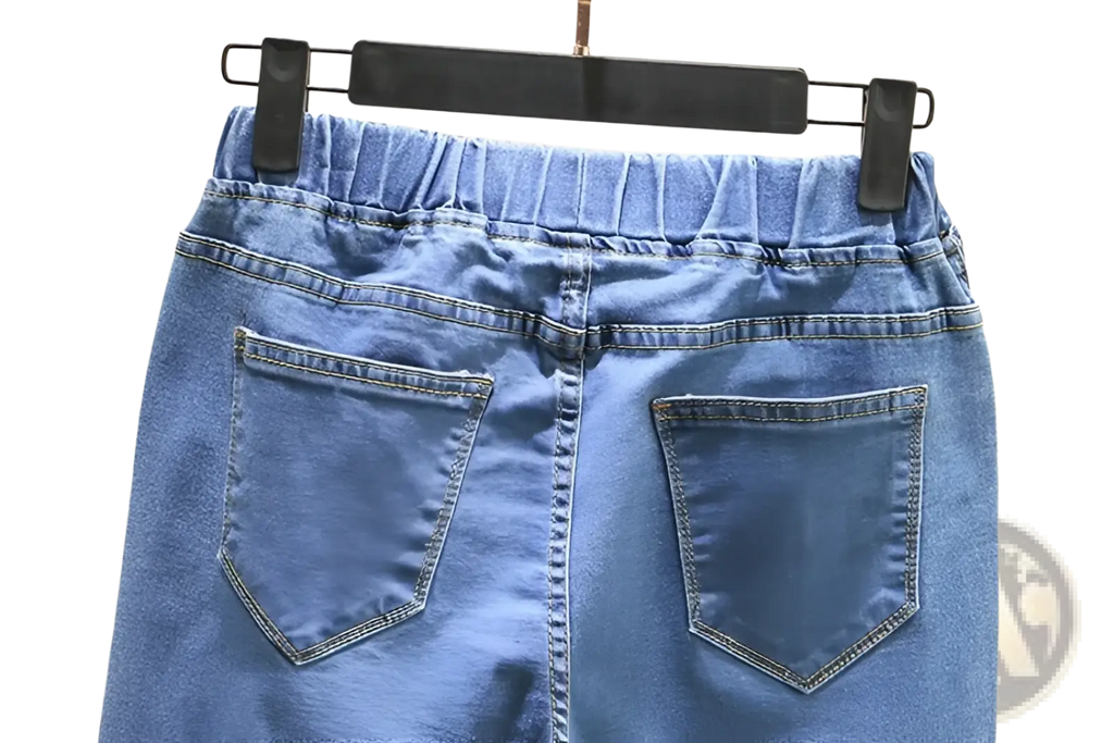 Back view of high waisted stretch light blue denim skirt with elastic waistband and two back pockets