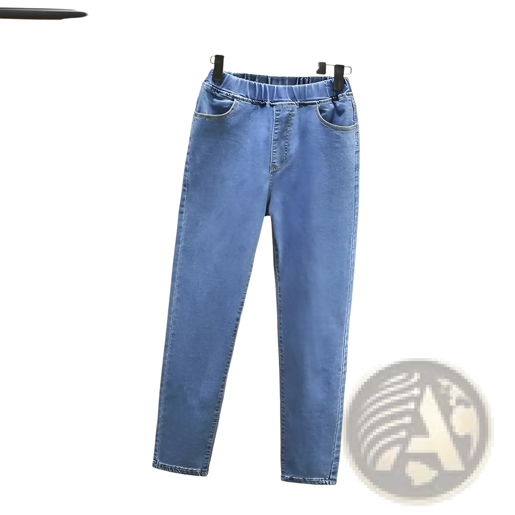 High waisted stretch light blue denim jeans in light wash with elastic waistband and classic front pockets
