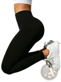 Black high waisted yoga leggings for women with a smooth, form fitting design and subtle texturing