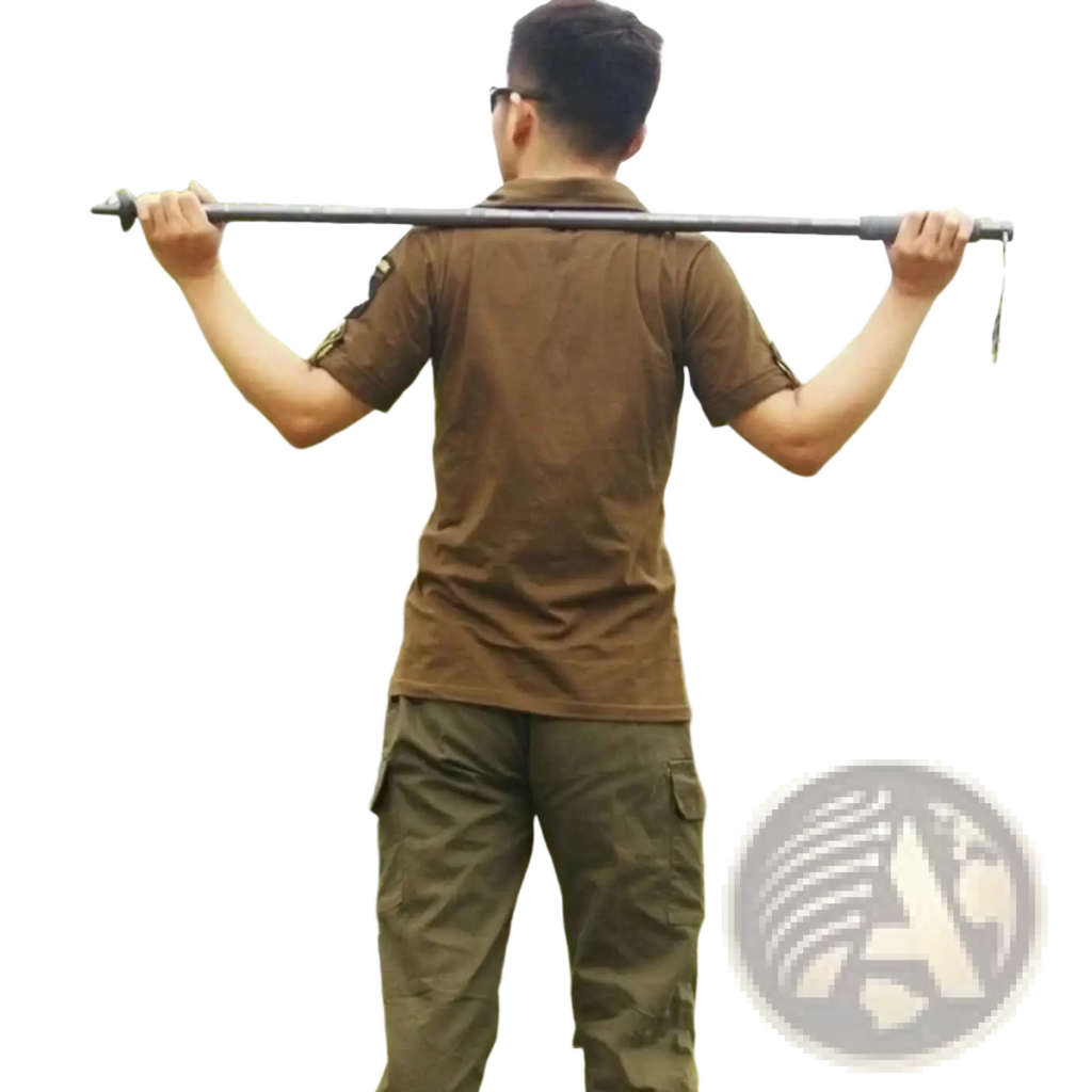 Black telescopic hiking pole with adjustable sections and textured grip in camping set with tactical knife visible